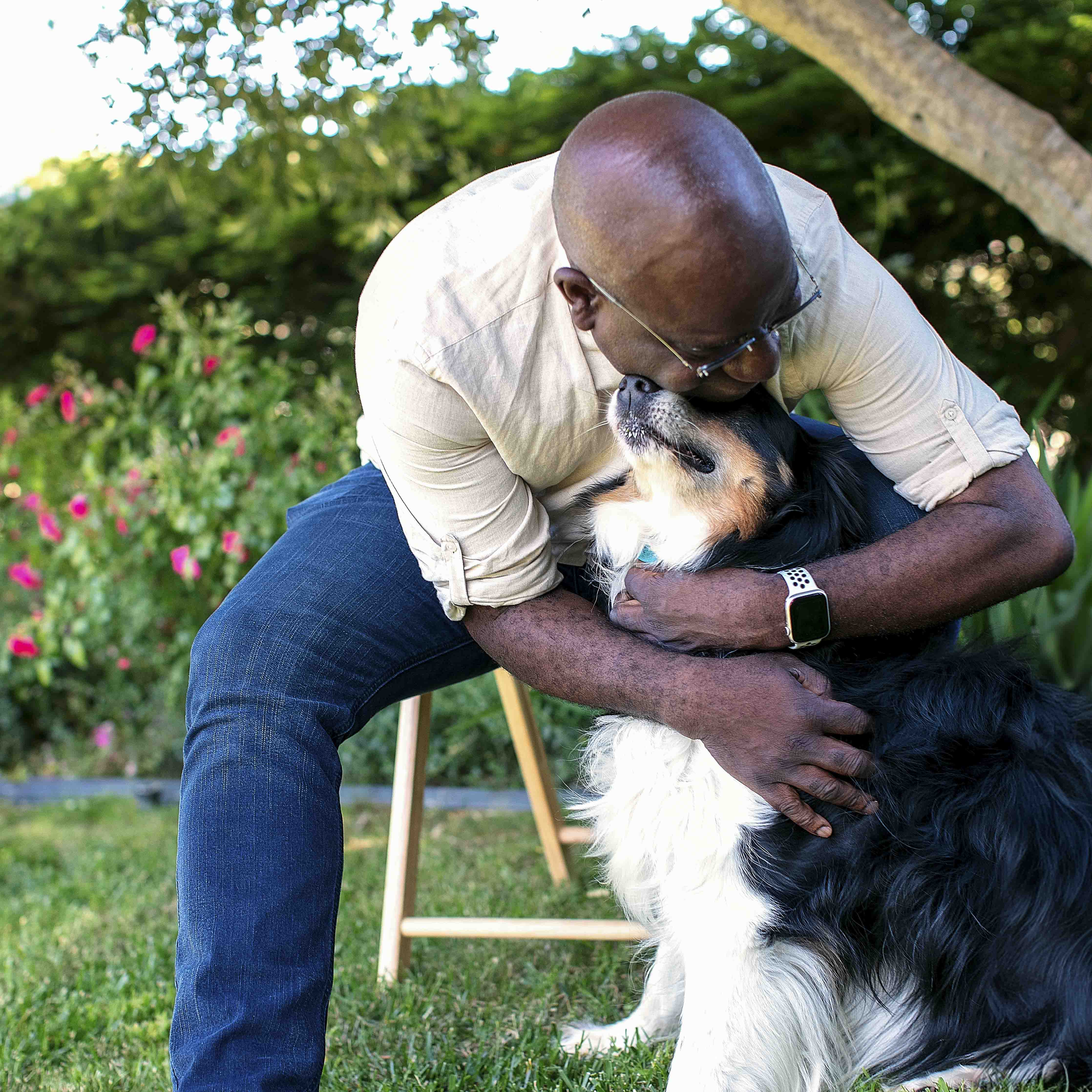 Man with hugging his dog